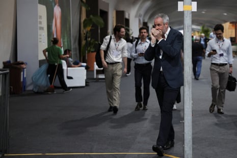 COP30 President Andre Correa do Lago speaks on the phone during the UN Climate Change Conference (COP30), in Belem, Brazil, November 22, 2025.