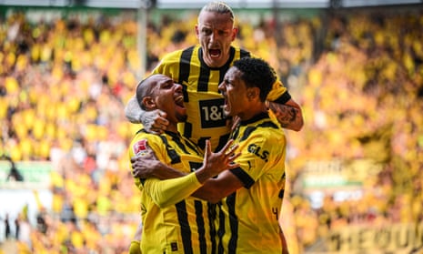Scorer Sébastien Haller celebrates his team's first goal against Augsburg with Donyell Malen and Marius Wolf