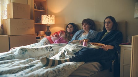 Billie, Deb and Josie wearing dressing gowns in bed with a tray of breakfast