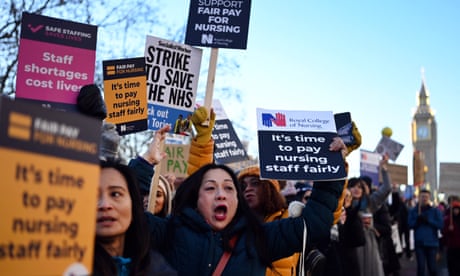 NHS nurses protest outside St Thomas' hospital in London on 15 December 2022.