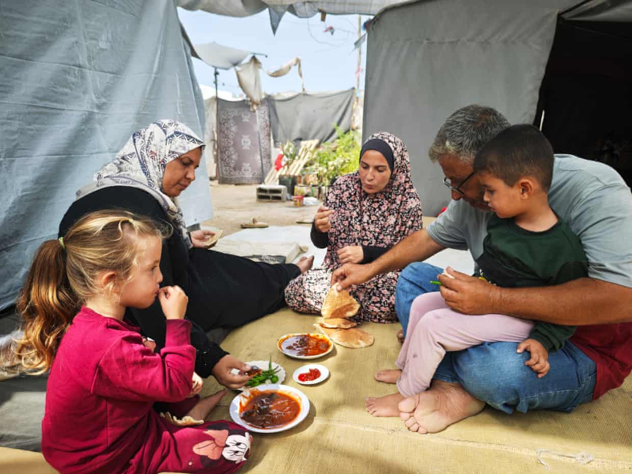Muqayed eating with her family