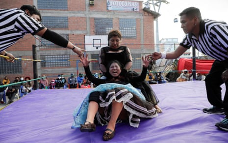 Silvana La Poderosa and Simplemente Maria, cholitas wrestlers, fight during their return to the ring.