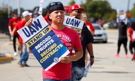 Striking United Auto Workers walk the picket line outside the Ford Michigan Assembly Plant in Wayne, Michigan, on Friday.