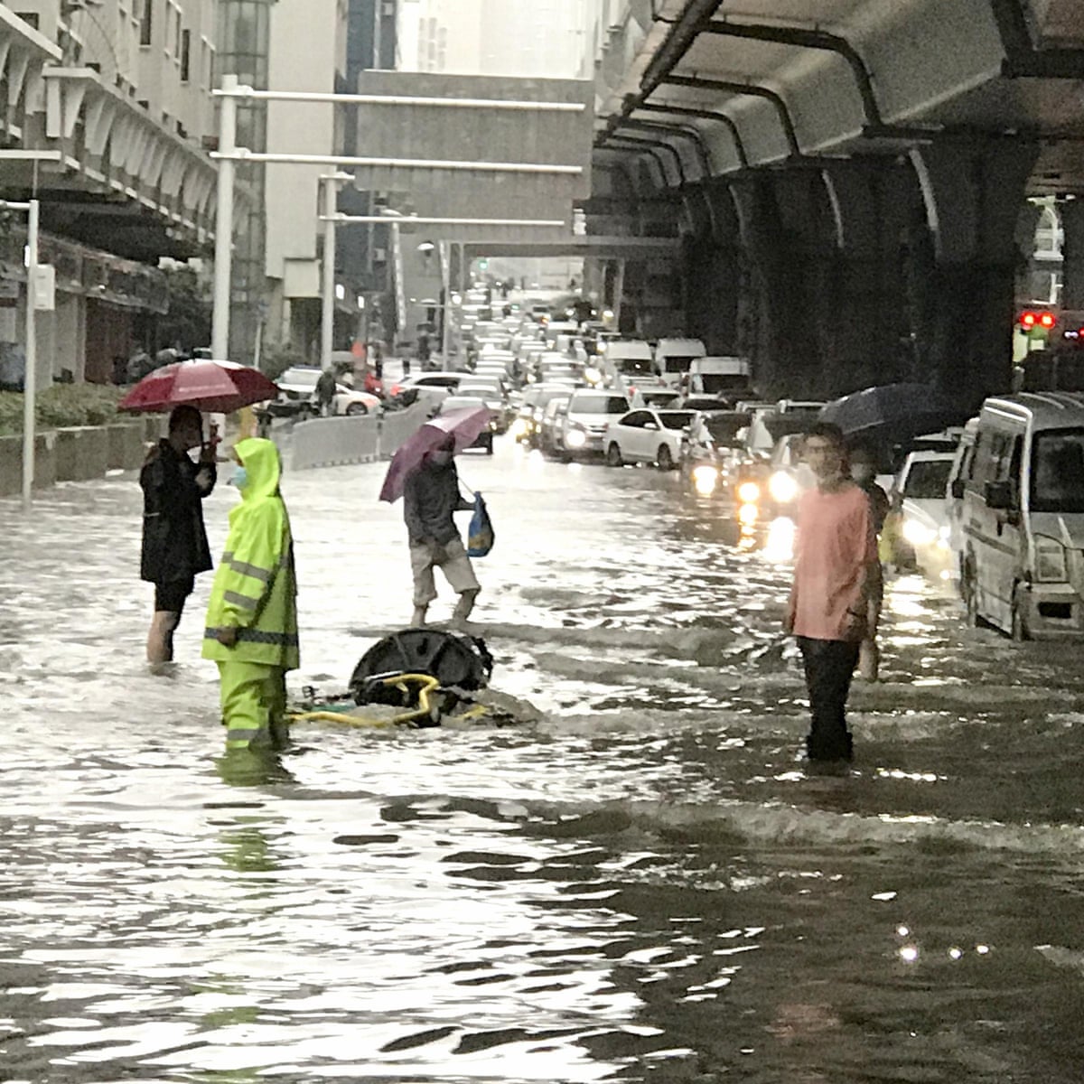 Wuhan residents told to stay indoors again after record rainfall | China | The Guardian