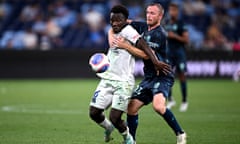 Nestory Irankunda of Adelaide United and Rhyan Grant of Sydney FC compete for the ball during an A-League match in January 2024