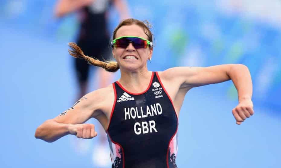Vicky Holland celebrates as she approaches the finishing line to win bronze in the triathlon at the Rio 2016 Olympic Games.