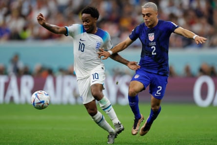Raheem Sterling tussles with Sergino Dest, who worried England with his overlapping runs.