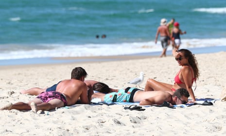 People relax on the beach at Burleigh Heads on Queensland’s Gold Coast