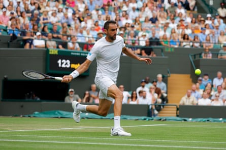 Marin Cilic closes in to play a forehand against Jack Draper