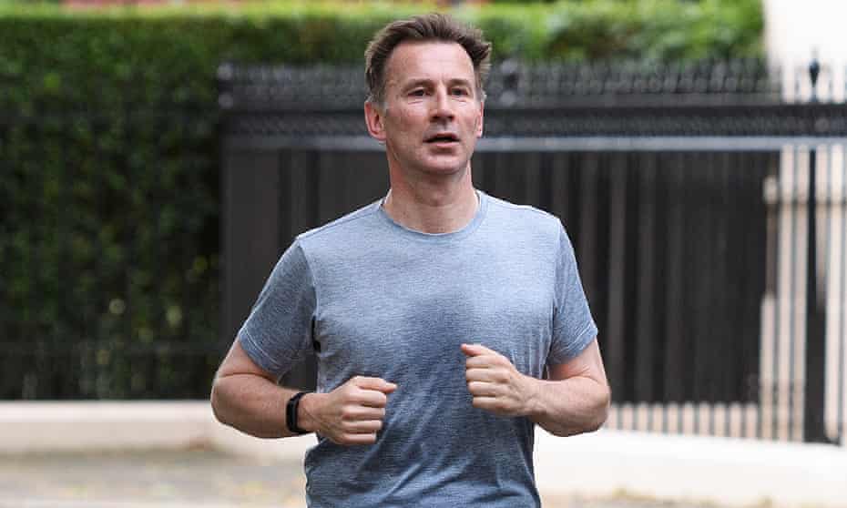 Jeremy Hunt returns home after a morning run in London