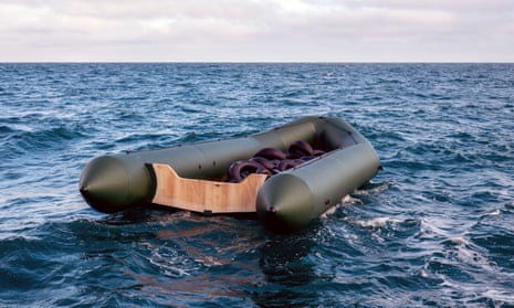 A dinghy drifting in the Channel. The woman said the smuggler was afraid the police would stop their boat from leaving so he pushed it out to sea.