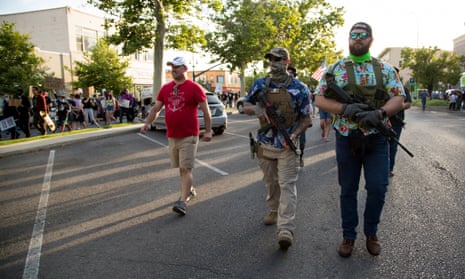 Armed counter protesters in Hawaiian shirts, suggestive of an affiliation with the boogaloo movement (a loosely organized far-right anti-government group), march in Provo, Utah.