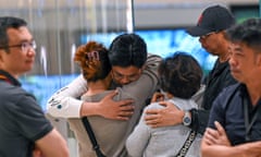 Passengers of Singapore Airlines flight SQ321 from London to Singapore, which made an emergency landing in Bangkok, greet family members upon arrival at Changi Airport in Singapore on May 2024. A 73-year-old British man died and more than 70 people were injuredduring severe turbulence.