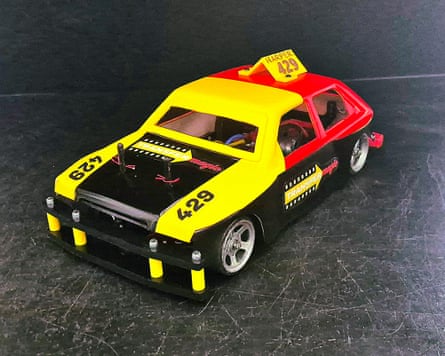 A red, yellow and black radio-controlled car.