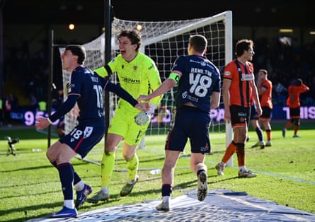 Dundee players celebrate their last-gasp equaliser