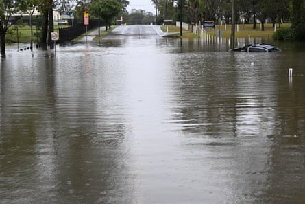 A car engulfed by flood waters on Buchanan Road at Morayfield, north of Brisbane on 22 October.