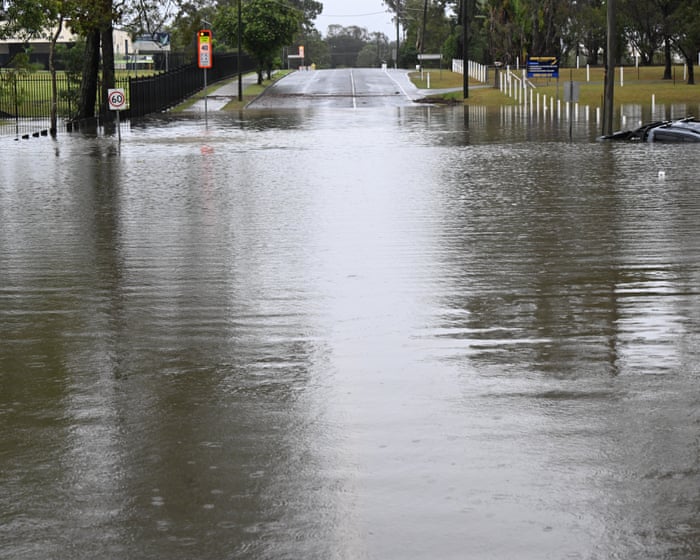 Man found dead in Queensland flood waters as state hit by days-long deluge