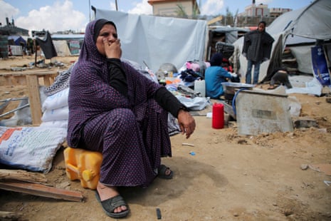 A displaced Palestinian woman in the makeshift tent camp at Rafah preparing to be displaced again, 7 May.