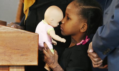 Four-year-old Somali refugee Mushkaad Abdi holds her doll during a Minneapolis news conference on 3 February 2017, one day after she was reunited with her family. Her trip from Uganda to Minnesota was held up by Donald Trump’s order barring refugees from seven predominantly Muslim nations.