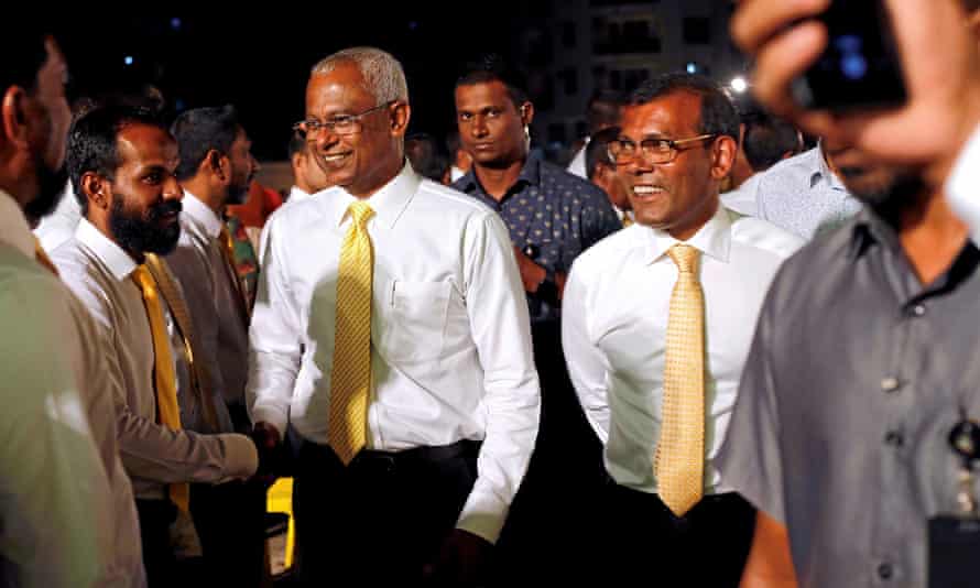 Nasheed (right) with the Maldives president, Mohamed Solih (centre left) at an election rally in Male in April 2019.