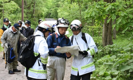 Rescuers search for 7-year-old Yamato Tanooka who is missing after being left in a forest as a punishment by his parents on Hokkaido Island, Japan.