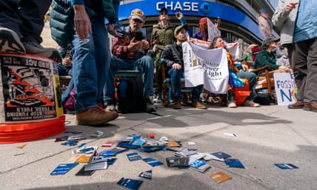 Activists put cut-up credit cards in front of a Chase bank during the protest.