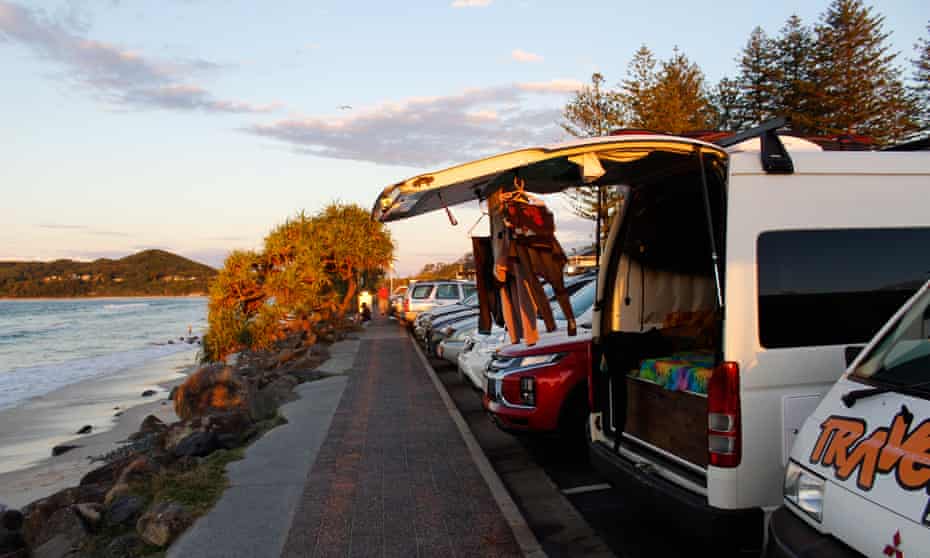 Children’s wetsuits are hung out to dry on a van parked at Byron Bay’s main beach in NSW, Australia.