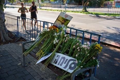 Flowers and a sign written in Hebrew reads “Sorry” are placed on a bench outside Abu Kabir, the forensic institute where the identification process is being carried out on the four bodies that were held by Hamas in the Gaza Strip, in Tel Aviv, Israel.
