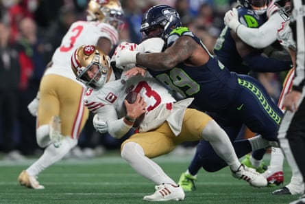 Seattle Seahawks defensive tackle Leonard Williams sacks San Francisco 49ers quarterback Brock Purdy during the second half of an NFL football divisional playoff game in January 2026.