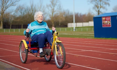 Elderly woman on a tricycle