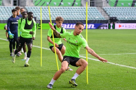 Antony of Real Betis runs between training poles during a training session