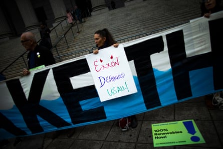 A woman holding a sign.