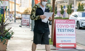 A man exits a Covid-19 testing center amid the coronavirus pandemic in Los Angeles.