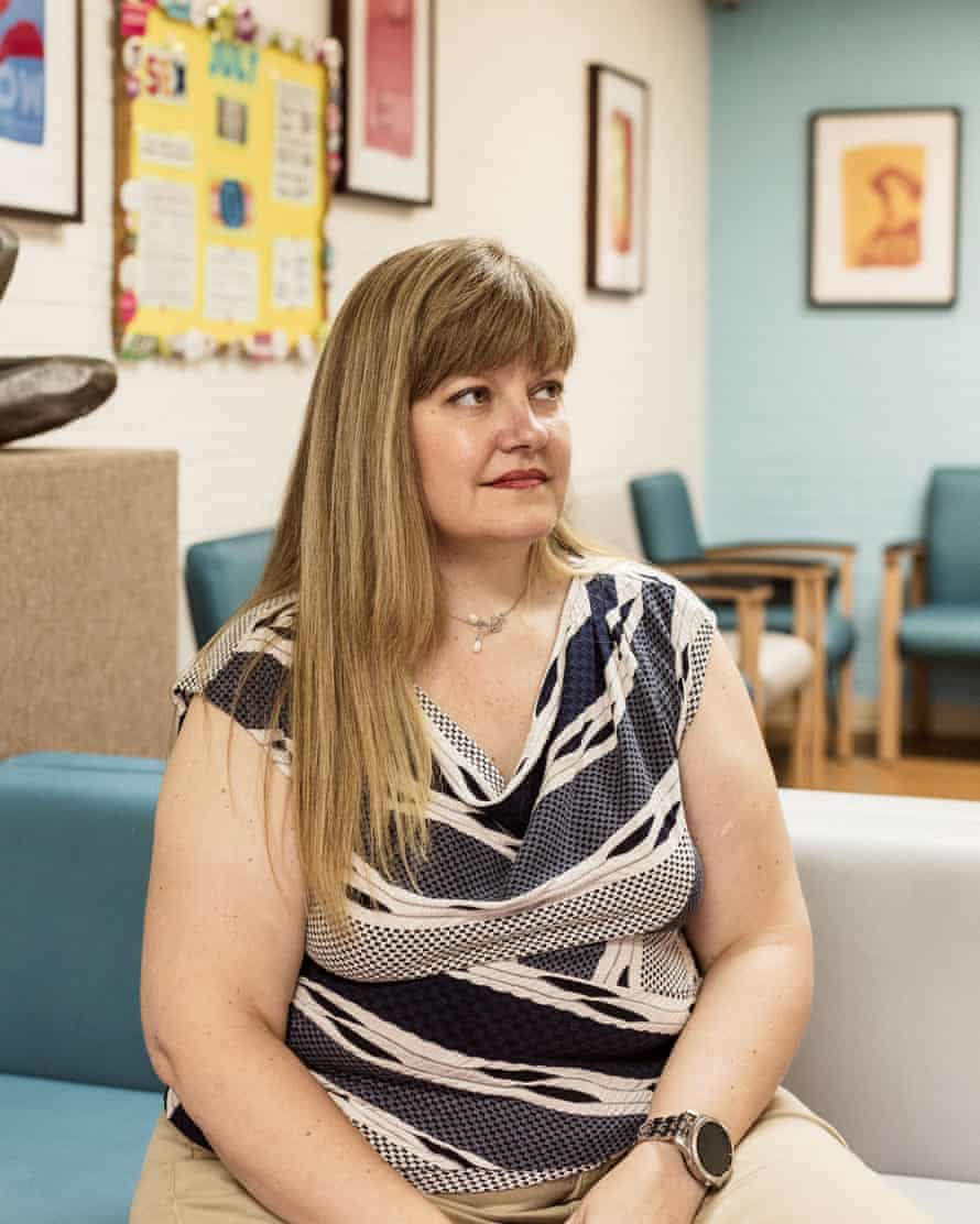 Dr Katherine Farris sits on a couch in the clinic