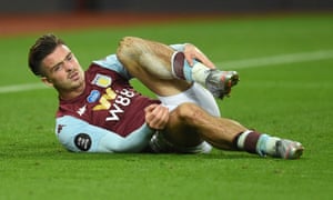 Aston Villa’s Jack Grealish lies injured.