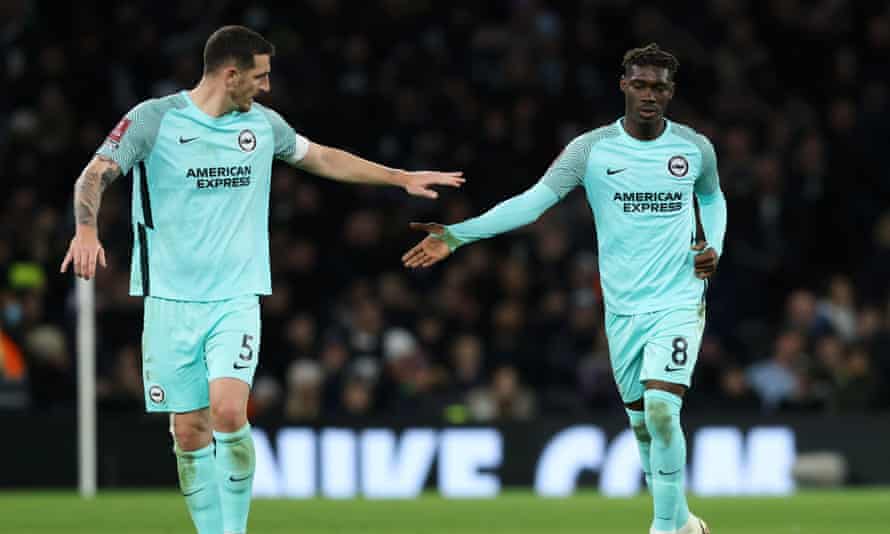 Yves Bissouma (right) is congratulated by a teammate after pulling a goal back for Brighton.