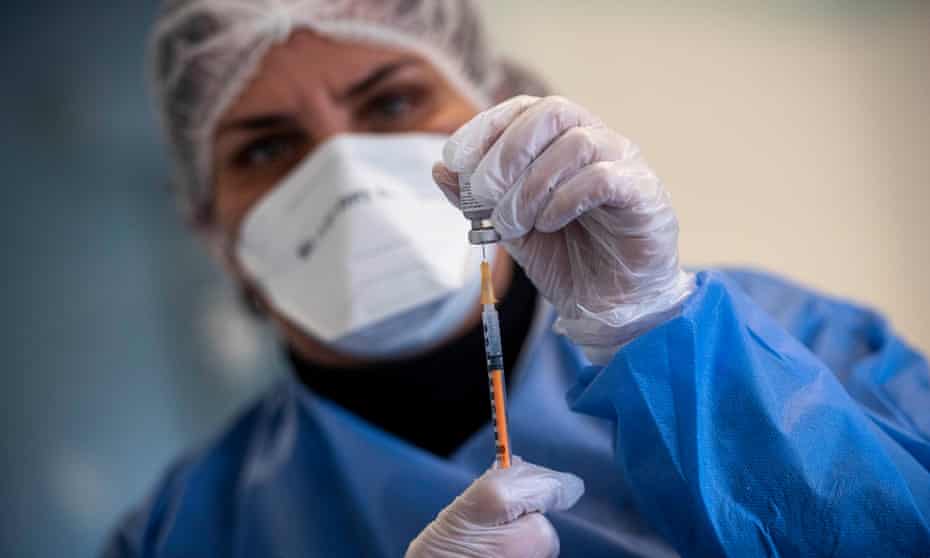 A healthcare worker prepares a dose of the Pfizer/BioNTech Covid-19 vaccine in Rome, Italy. 