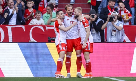 Harry Kane celebrates with his Bayern teammates after scoring his first goal of the afternoon.