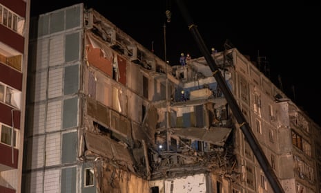 Emergency personnel work at the apartment block in Uman after Friday’s attack