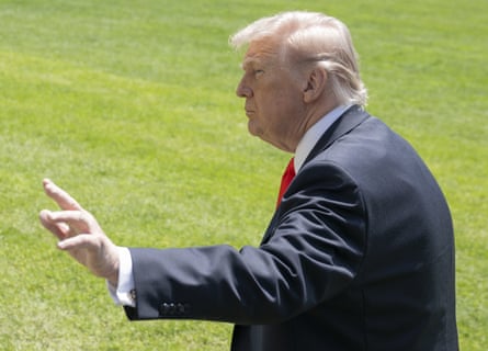 Donald Trump speaks to the press before departing the White House for Florida