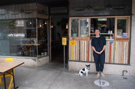 Joanna Wilson, owner of John Gorilla cafe in East Brunswick, with her dog Dizzy, speaking about the price hike of raw ingredients for one of the most popular dish the Avocado Piquillo with a side of bacon and a coffee.