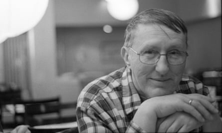 An older man pictured in black and white.