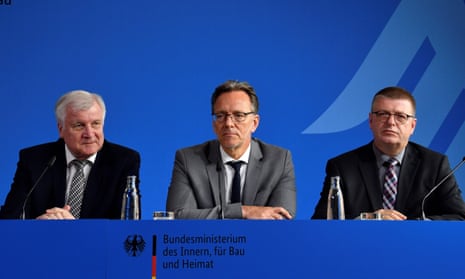 Horst Seehofer, left, Holger Münch, centre, and Thomas Haldenwang speak at a press conference on the murder of Walter Lübcke