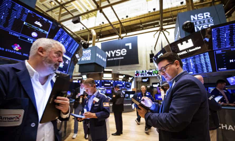 Traders work on the floor of the New York Stock Exchange