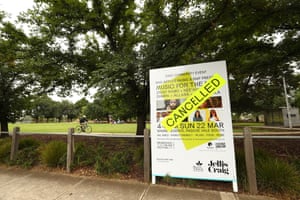 A cancelled sign is seen on a billboard advertising a local festival at Shore Reserve, on March 21, 2020 in Melbourne, Australia.