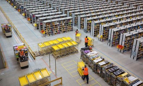 Operations At An Amazon.com Inc. Fulfillment Centre And An Argos Distribution Warehouse On Cyber Monday. Employees push empty carts as they prepare to process customer orders ahead of shipping at one of Amazon.com Inc.’s fulfillment centers in Rugeley, U.K., on Monday, Dec. 2, 2013. 