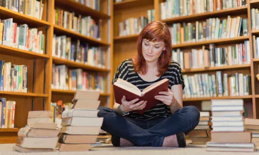 A girl reading a library