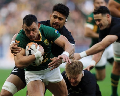 South Africa's Jesse Kriel barges through to score their first try.