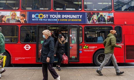 An advert on a London bus promoting flu and Covid booster jabs