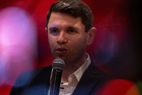 James Talarico speaks into a microphone